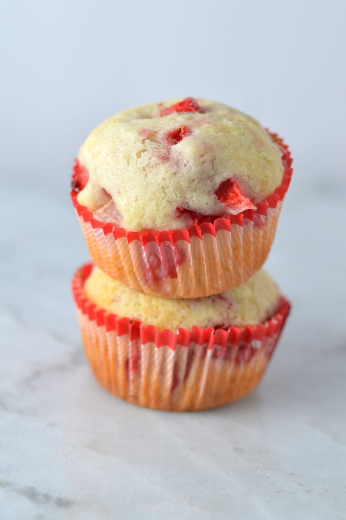 Healthy Strawberry Muffins made with olive oil. This is a great recipe to make as a nut free snack to bring to work, or a quick and easy grab and go breakfast idea.