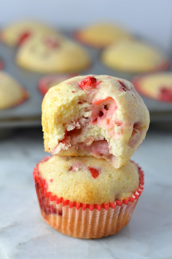 Healthy Strawberry Muffins made with olive oil. This is a great recipe to make as a nut free snack to bring to work, or a quick and easy grab and go breakfast idea.