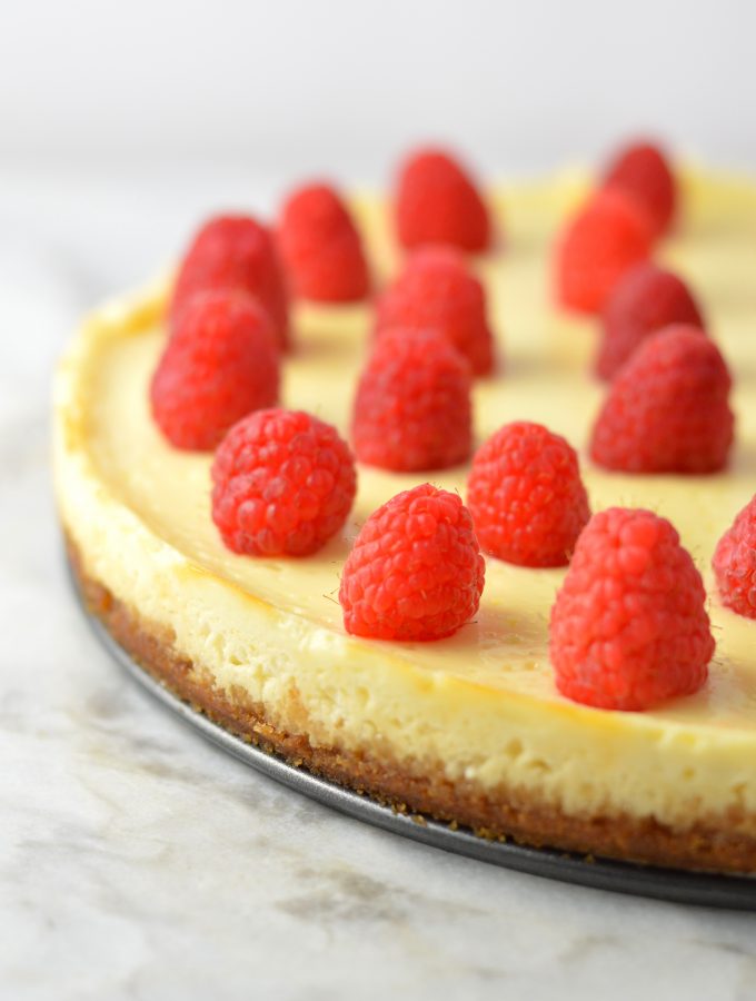 Healthy Greek Yogurt Raspberry Cheesecake recipe. Less calories and fat than your typical cheesecake, and tastes virtually the same!