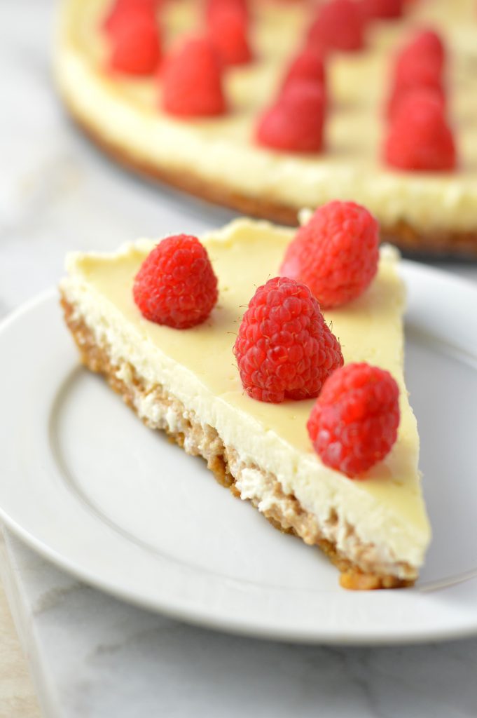 Healthy Greek Yogurt Raspberry Cheesecake recipe. Less calories and fat than your typical cheesecake, and tastes virtually the same!