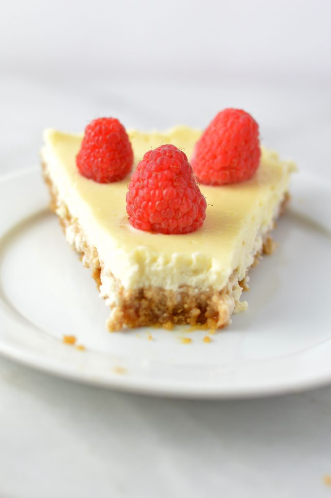 Healthy Greek Yogurt Raspberry Cheesecake recipe. Less calories and fat than your typical cheesecake, and tastes virtually the same!