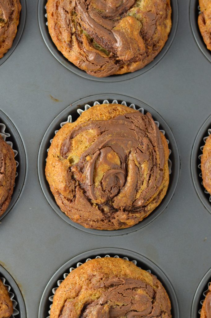 Easy Nutella Swirl Banana Muffins that are perfect for a grab and go breakfast idea. A great recipe to use up 2 ripe bananas.