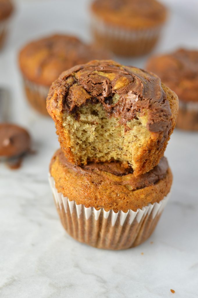 Easy Nutella Swirl Banana Muffins that are perfect for a grab and go breakfast idea. A great recipe to use up 2 ripe bananas.