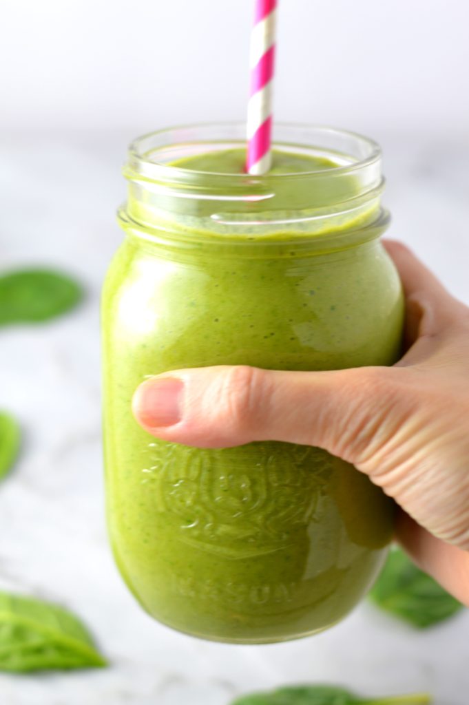 Easy Mango Green Smoothie recipe. Made with spinach and bananas, this healthy drink recipe is healthy and vegan and makes a great breakfast idea