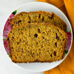 Peanut Butter Banana Bread with Peanut Butter Glaze on a small white plate.