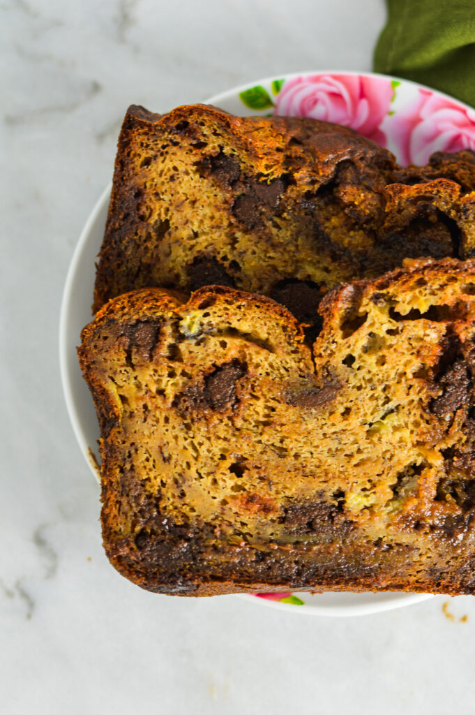 Slices of soft Peanut Butter Cup Banana Bread on a small white plate.