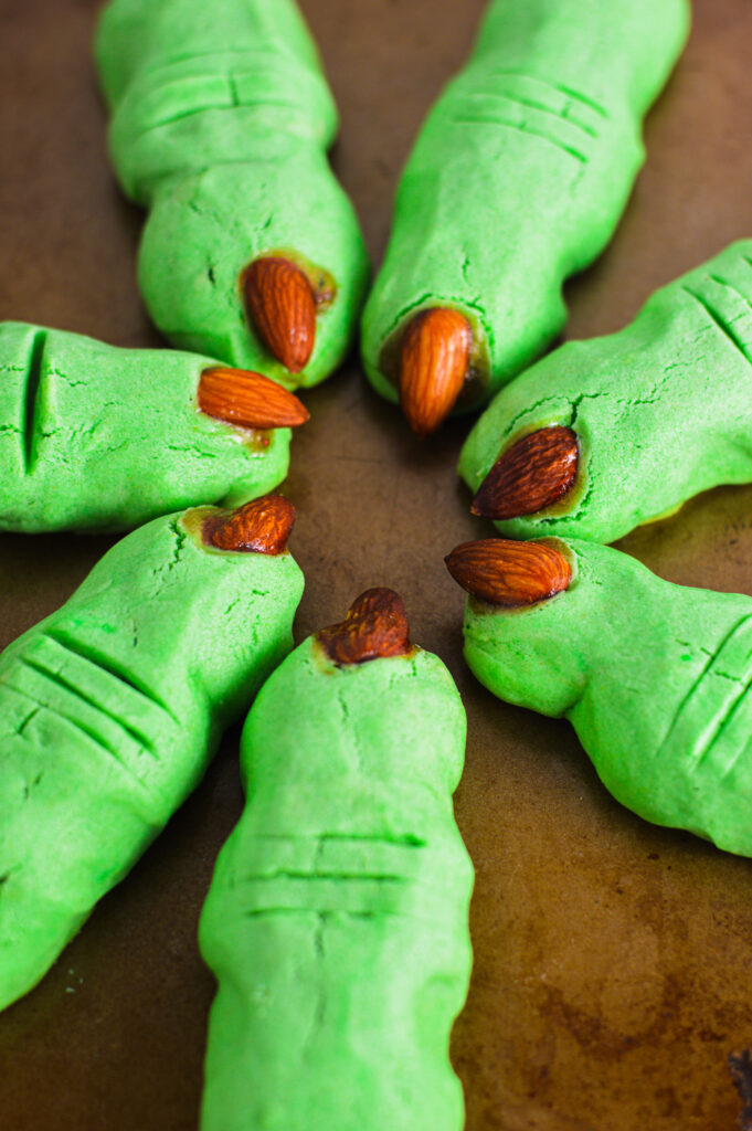 Witch Finger Cookies arranged with the almond fingernails pointing at each other.