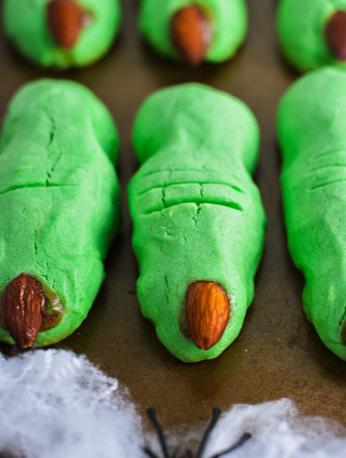 Witch Finger Cookies lying flat on a baking sheet.