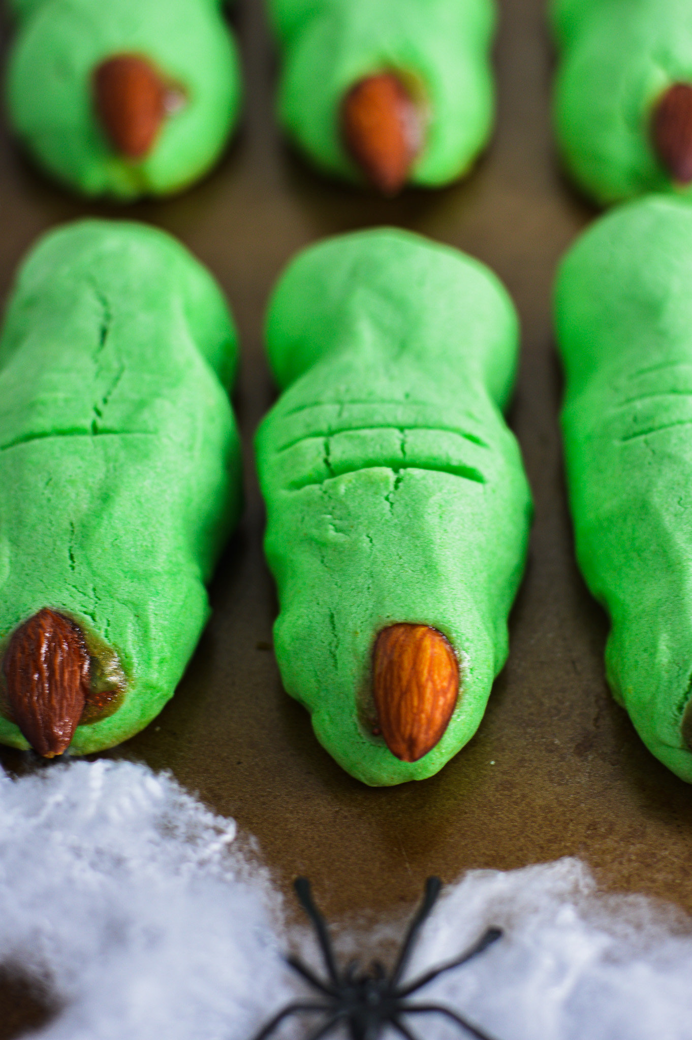 Witch Finger Cookies lying flat on a baking sheet.