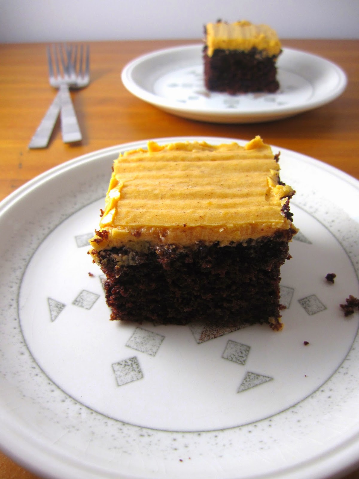 This Whole Wheat Chocolate Cake with Orange Frosting is the perfect recipe for Halloween! Black and orange, it is a great festive dessert.