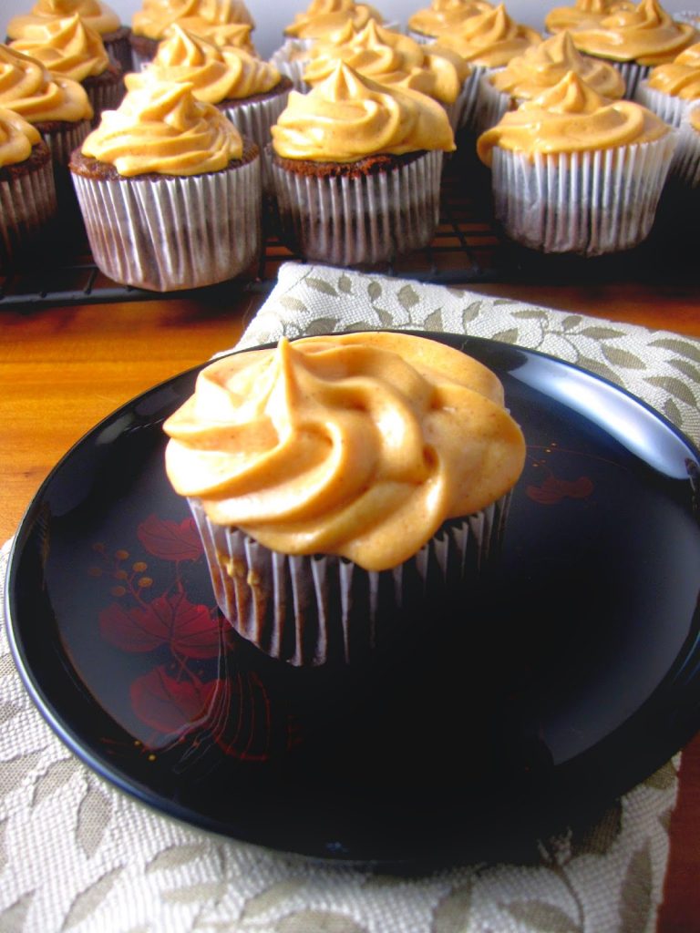 These Spiderweb Cupcakes are perfect for Halloween desserts. Made with a chocolate spiderweb to decorate the cake and orange colored frosting.