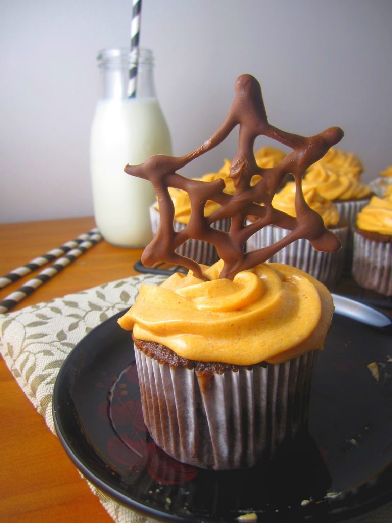 These Spiderweb Cupcakes are perfect for Halloween desserts. Made with a chocolate spiderweb to decorate the cake and orange colored frosting.