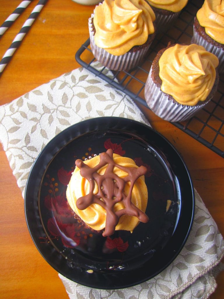 These Spiderweb Cupcakes are perfect for Halloween desserts. Made with a chocolate spiderweb to decorate the cake and orange colored frosting.