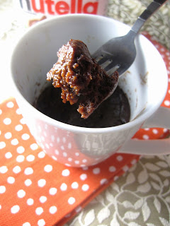 Microwave Banana Nutella Mug Cake made without self rising flour. This cake doesn't use eggs, this makes the perfect last minute dessert recipe.