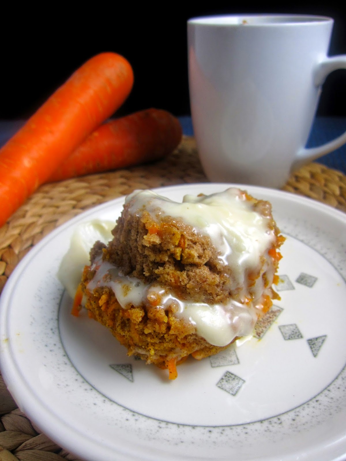 Single serving Carrot Cake Mug Cake made in a microwave. This cake is eggless and topped with cream cheese icing, it is the perfect last minute dessert recipe.