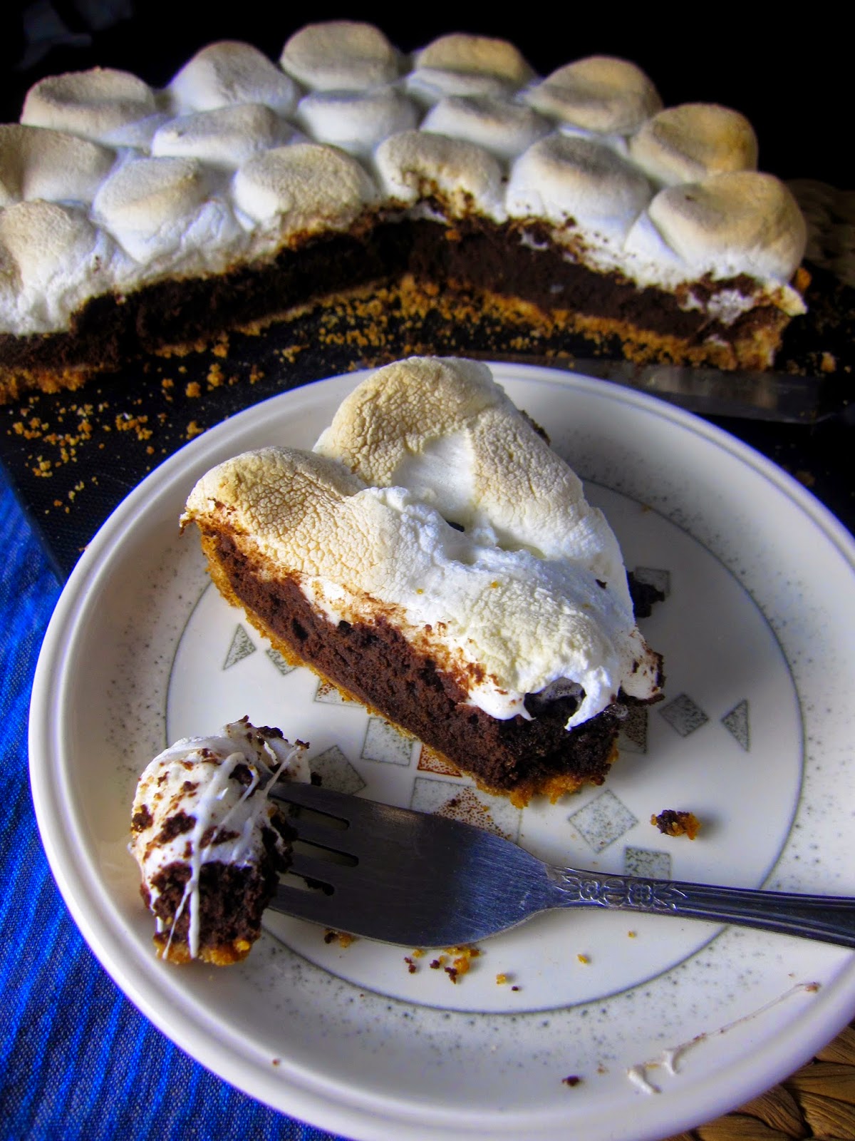 Smores Brownie Pie with a graham cracker crust. This recipe is perfect for a dessert that makes it feel like summer all year long.