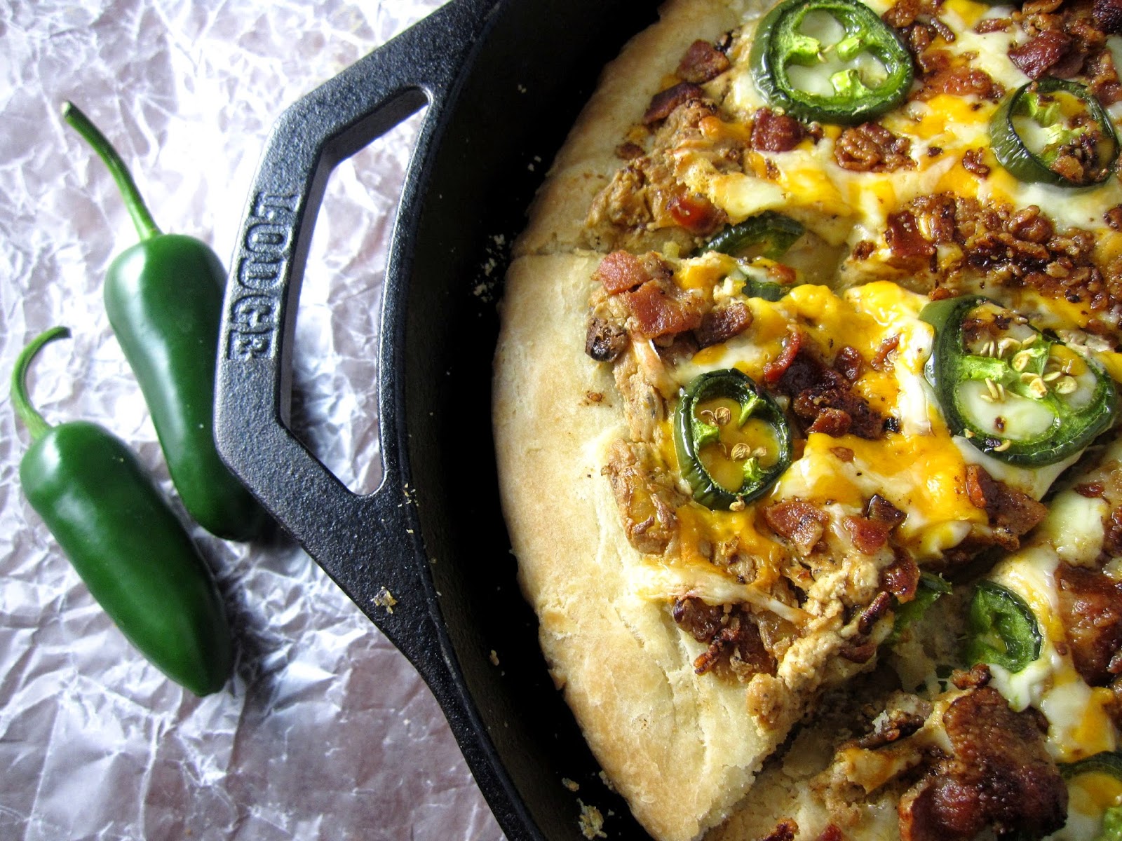 This Jalapeno Popper Skillet Pizza recipe is the pizza recipe I make most often. Such a delicious dinner idea made in a cast iron skillet.