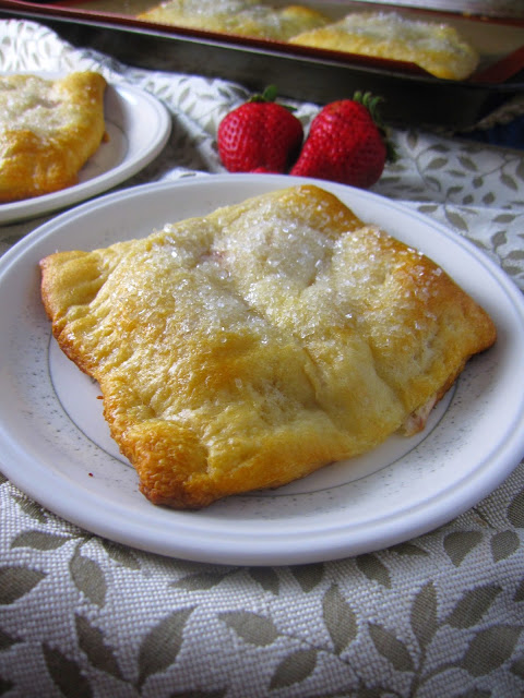 Easy Strawberry Raspberry Cream Cheese Danishes made with refrigerated crescent rolls, fresh strawberries and raspberry jam.