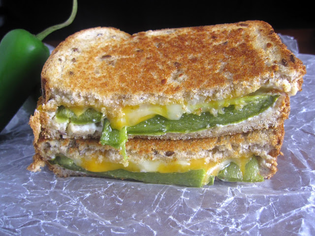 Grilled cheese sandwich with roasted jalapenos and slathered in cream cheese. The only thing missing from this jalapeno popper grilled cheese sandwich is bacon bits!