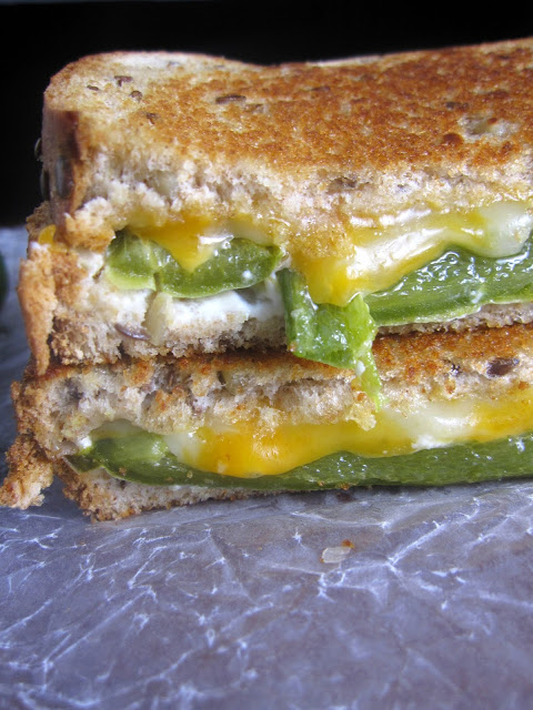 Grilled cheese sandwich with roasted jalapenos and slathered in cream cheese. The only thing missing from this jalapeno popper grilled cheese sandwich is bacon bits!