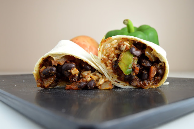 These bean and rice burritos are both spicy and really easy to make! They are also excellent with melted cheese on top.