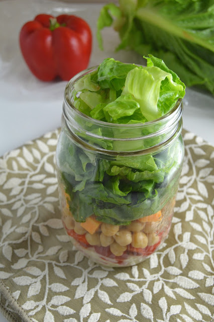 This romaine lettuce and chickpea mason jar salad is so portable and easy to make, you will want to make it for work and school every day of the week!