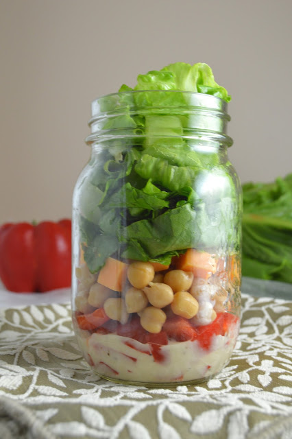 This romaine lettuce and chickpea mason jar salad is so portable and easy to make, you will want to make it for work and school every day of the week!