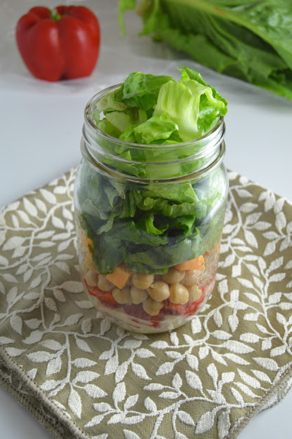 This romaine lettuce and chickpea mason jar salad is so portable and easy to make, you will want to make it for work and school every day of the week!