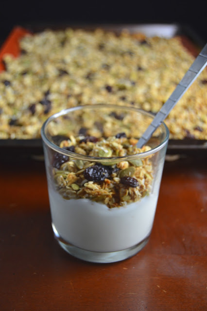 Crunchy healthy applesauce and pumpkin seed granola that is healthy and not too sweet! Perfect as a topping on yogurt, or eating by the handful!