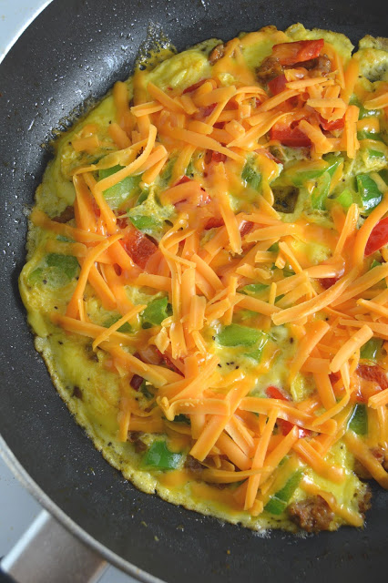 This Sausage and Bell Pepper Omelette is start to the day! With both green and red peppers, and oozing with cheese, it is guaranteed to keep you satisfied until lunch.