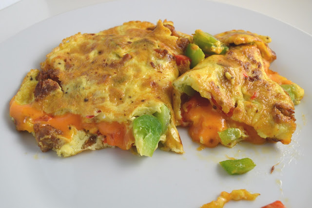 This Sausage and Bell Pepper Omelette is start to the day! With both green and red peppers, and oozing with cheese, it is guaranteed to keep you satisfied until lunch.