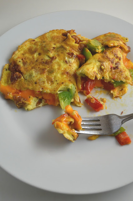 This Sausage and Bell Pepper Omelette is start to the day! With both green and red peppers, and oozing with cheese, it is guaranteed to keep you satisfied until lunch.