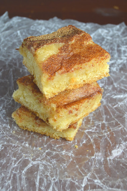 These gooey cinnamon squares are gooey on the inside, with a nice sturdy cookie crust. The cinnamon sugar sprinkled on top just sends these bars over the edge!