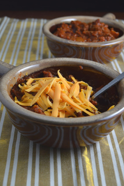 This spicy slow cooker chili is a great dinner recipe on a cold day. Made in a crockpot and filled with ground beef, this dish screams comfort food.