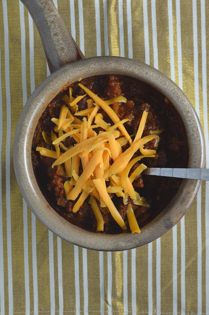 This spicy slow cooker chili is a great dinner recipe on a cold day. Made in a crockpot and filled with ground beef, this dish screams comfort food.