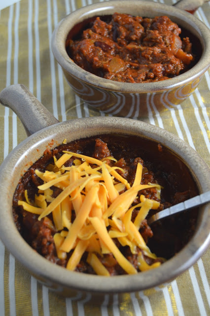 This spicy slow cooker chili is a great dinner recipe on a cold day. Made in a crockpot and filled with ground beef, this dish screams comfort food.