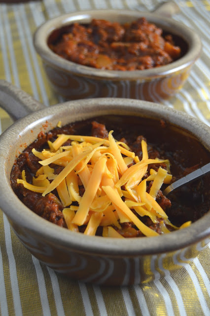 This spicy slow cooker chili is a great dinner recipe on a cold day. Made in a crockpot and filled with ground beef, this dish screams comfort food.