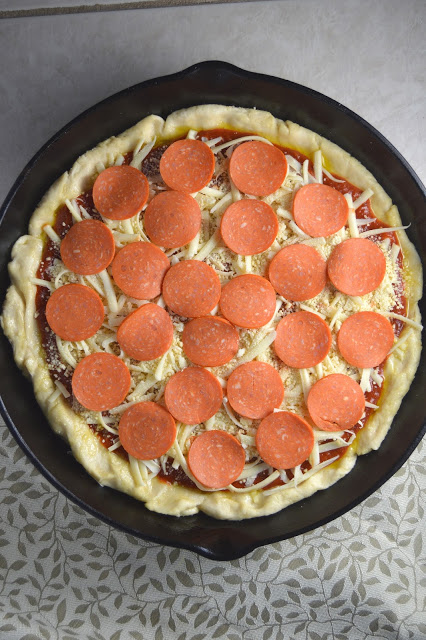 A pepperoni skillet pizza recipe that will keep you coming back for more! Deep dish pizza in a cast iron skillet.