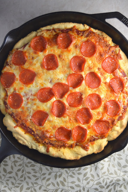 A pepperoni skillet pizza recipe that will keep you coming back for more! Deep dish pizza in a cast iron skillet.