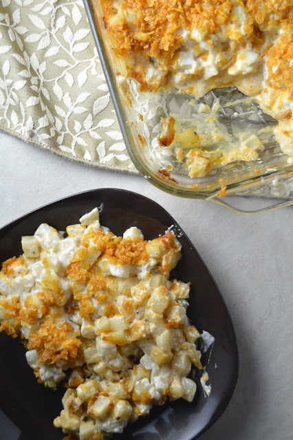 Cheesy hashbrown casserole that is so easy to make! The crunchy cornflake topping is one of the best things to happen on this casserole.