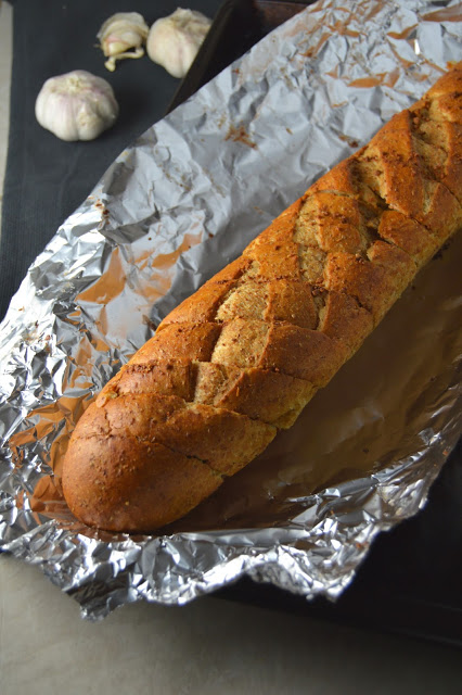 This easy garlic bread makes a regular appearance at my house when I need a side to go with pasta. Ready in under 30 minutes, and only 4 ingredients.