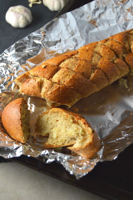 This easy garlic bread makes a regular appearance at my house when I need a side to go with pasta. Ready in under 30 minutes, and only 4 ingredients.