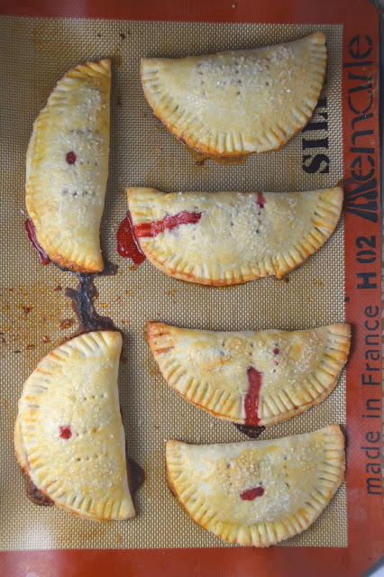 Delicious strawberry hand pies made from scratch, and bursting with strawberries! These make the perfect dessert or grab-and-go breakfast.