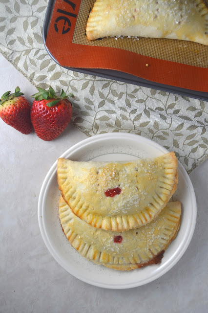 Delicious strawberry hand pies made from scratch, and bursting with strawberries! These make the perfect dessert or grab-and-go breakfast.