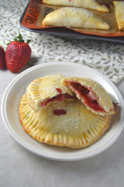 Delicious strawberry hand pies made from scratch, and bursting with strawberries! These make the perfect dessert or grab-and-go breakfast.