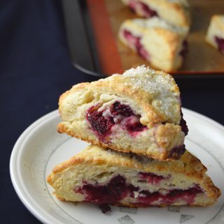 Scones bursting with raspberries in every bite. The coarse sugar topping makes them wonderfully crunchy on top.