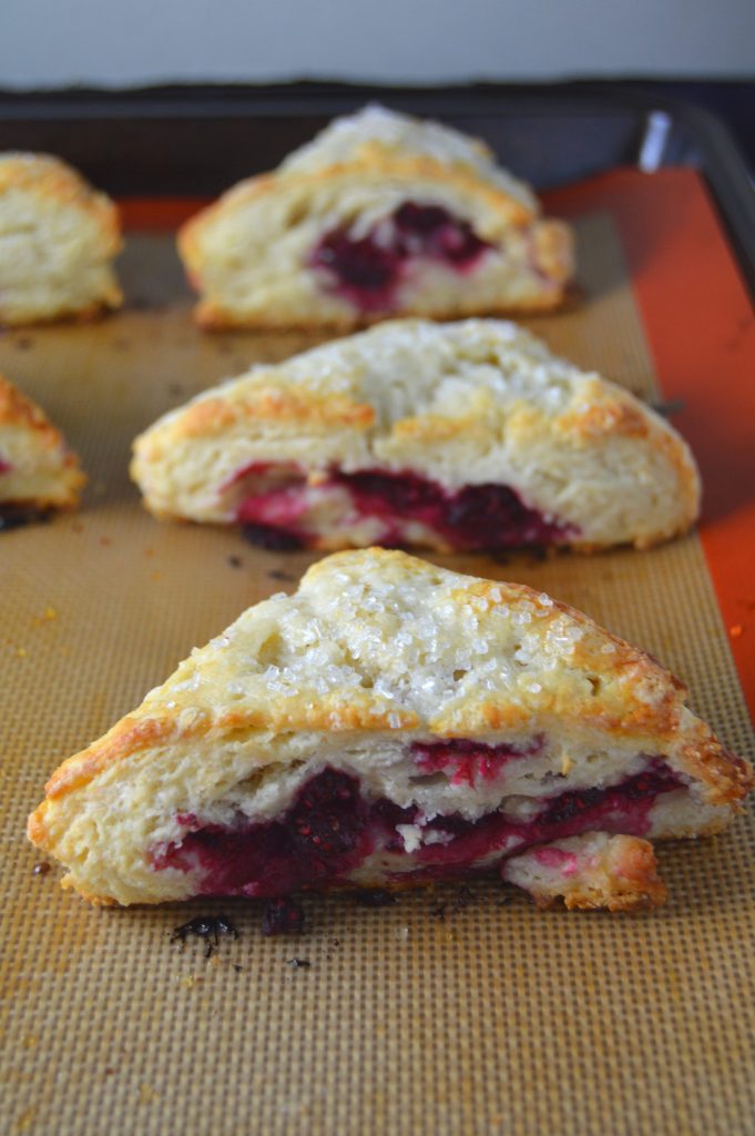 Scones bursting with raspberries in every bite. The coarse sugar topping makes them wonderfully crunchy on top.