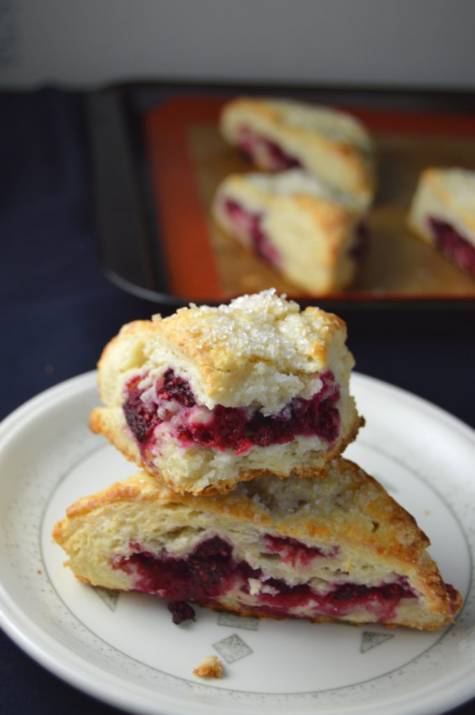 Scones bursting with raspberries in every bite. The coarse sugar topping makes them wonderfully crunchy on top.