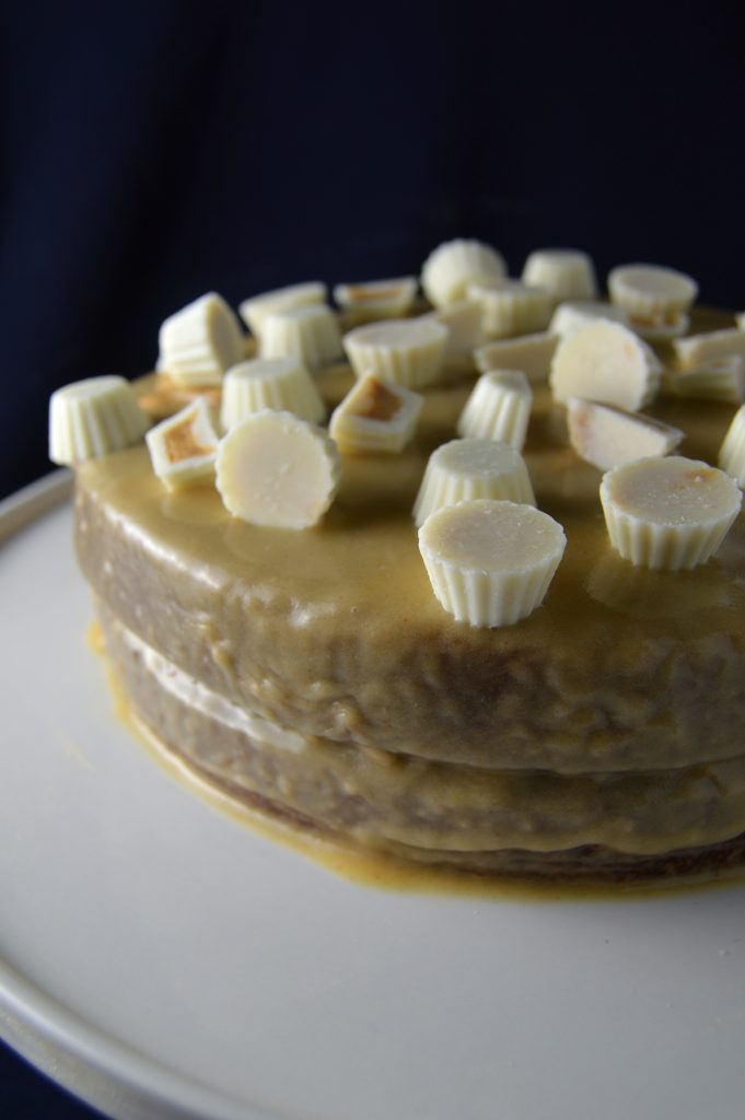 Chocolate Layer Cake with Peanut butter glaze.The perfect combination of chocolate cake and peanut butter glaze. Don't forget the peanut butter cups on top!