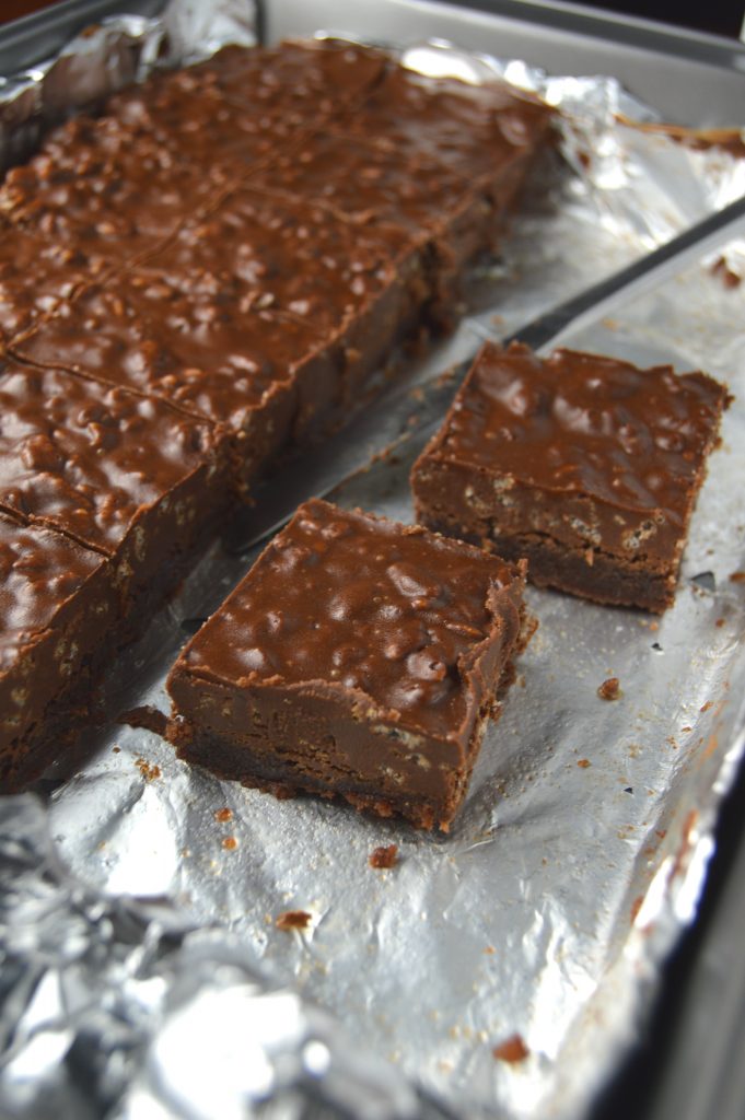 Fudgy Nutella brownies topped with a rich chocolate, peanut butter and rice krispies layer.